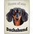 Artique Plaque Home of our Dachshund Black
